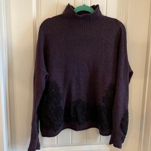 Long sleeve purple sweater with black embroidery